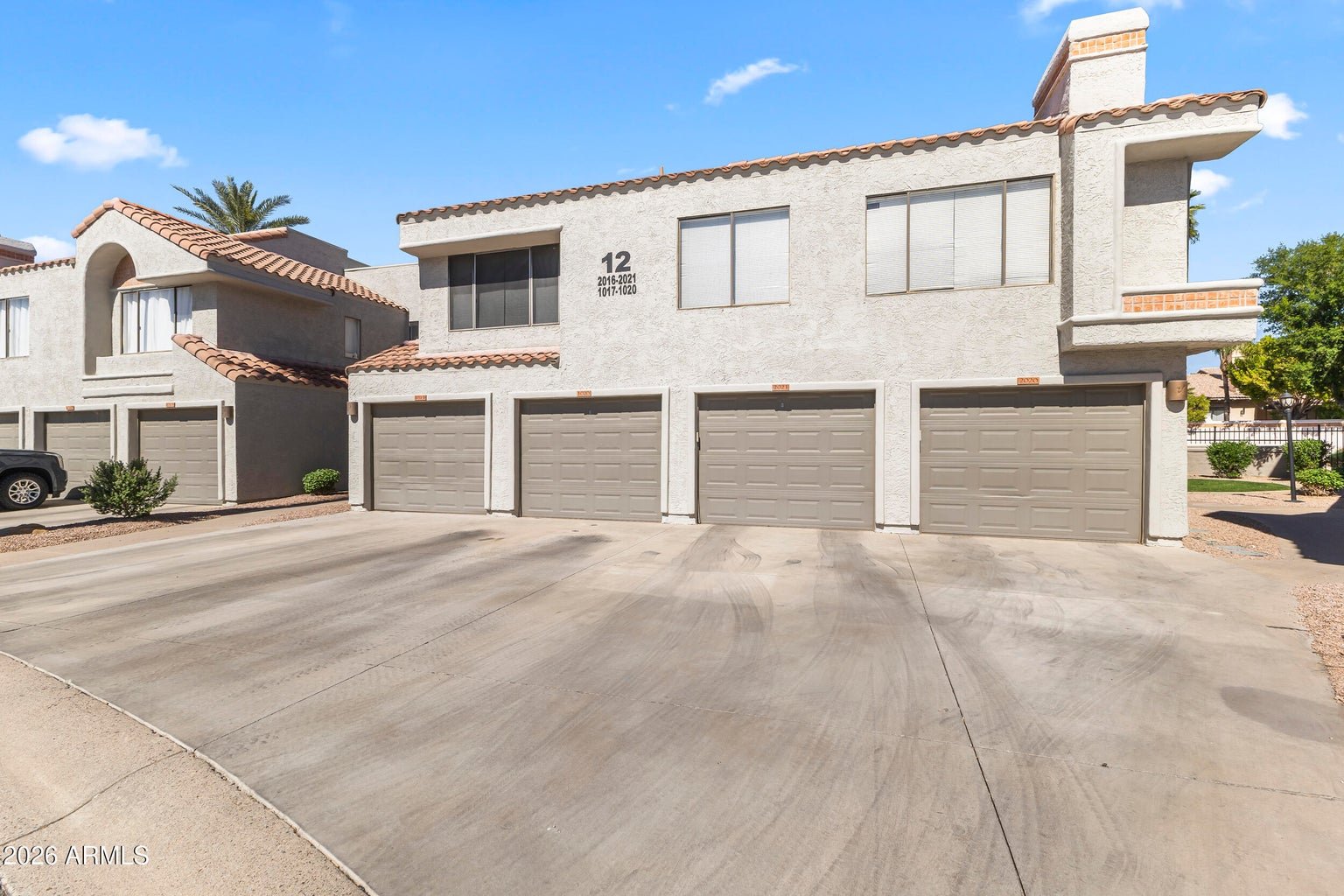 Front exterior of the townhouse building at 10055 E Mountainview Lake Dr 1019 in Scottsdale