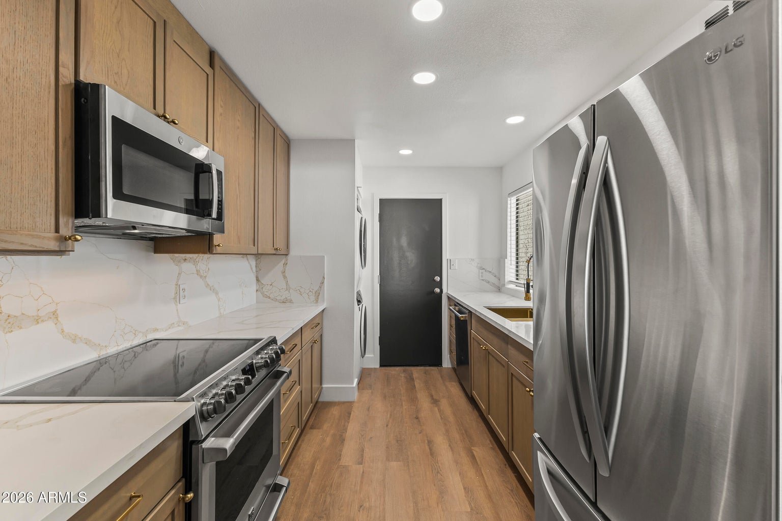 Kitchen with quartz countertops and stainless steel appliances