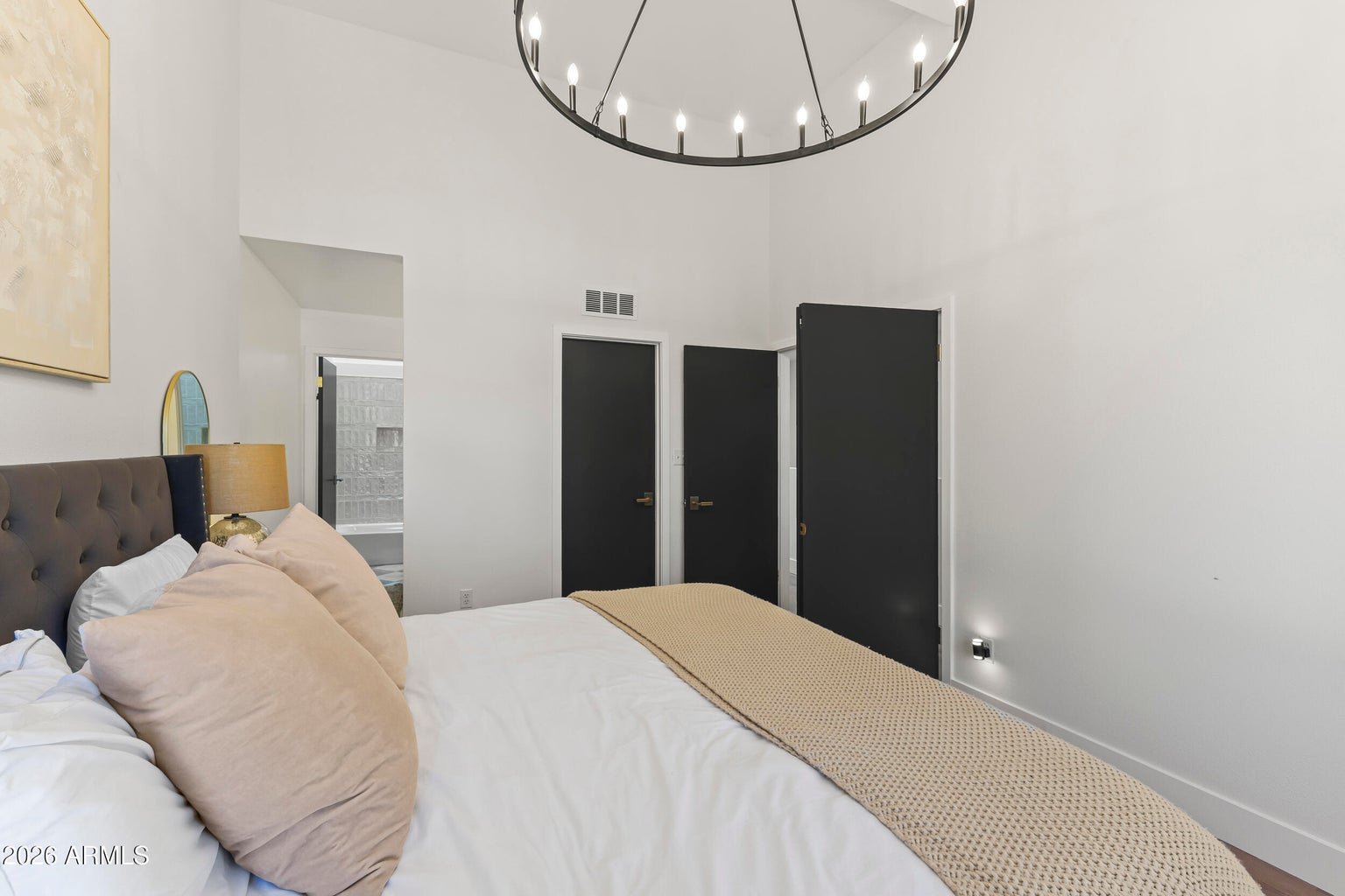 Second primary suite bedroom with a tufted headboard
