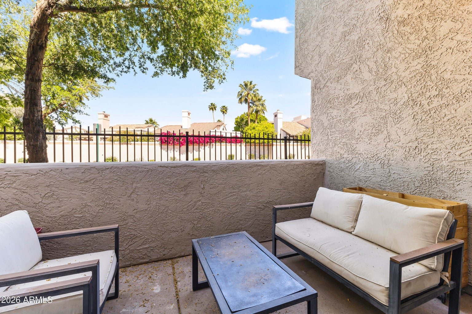 Private covered balcony with seating and mountain views