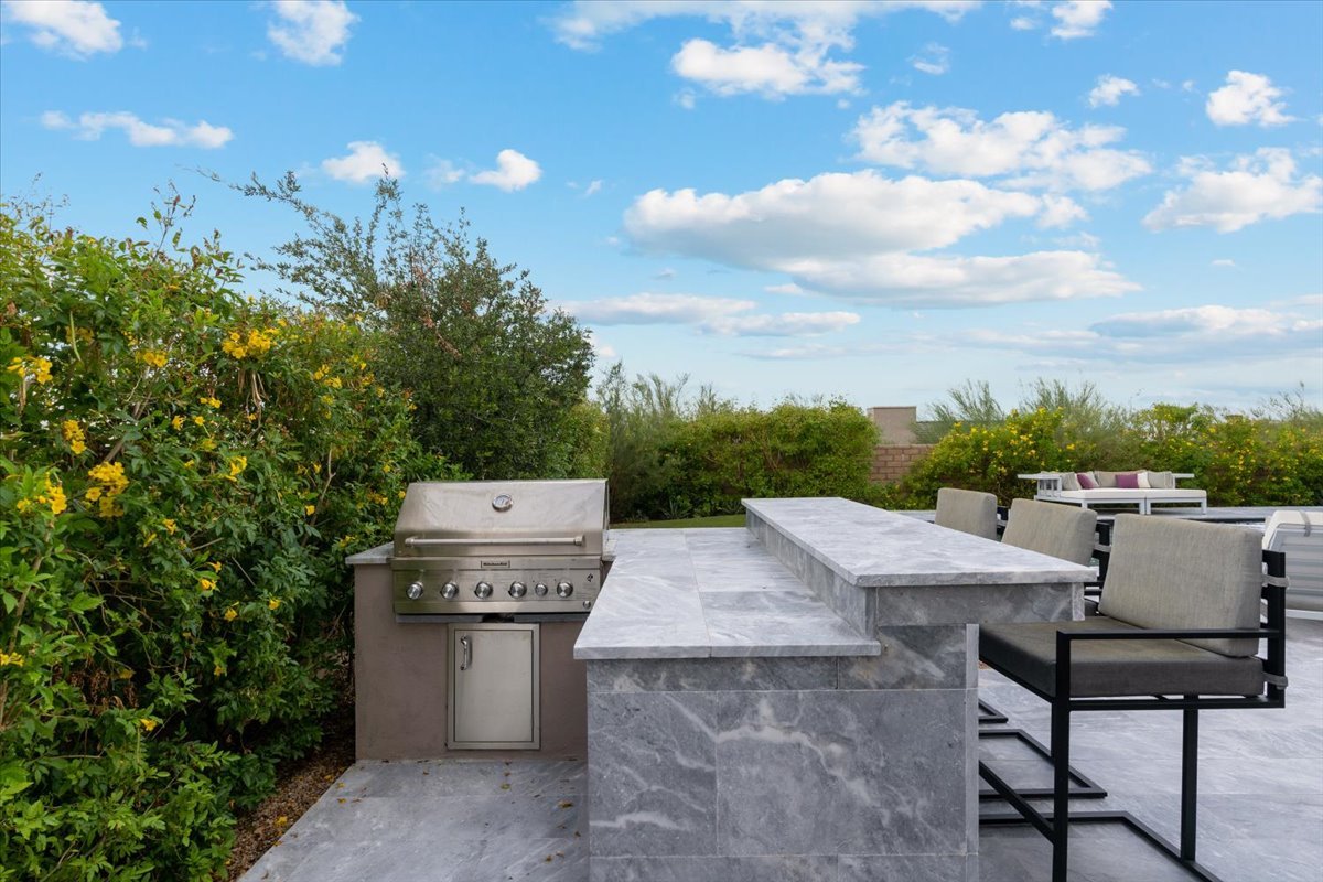Outdoor kitchen with a built in barbecue