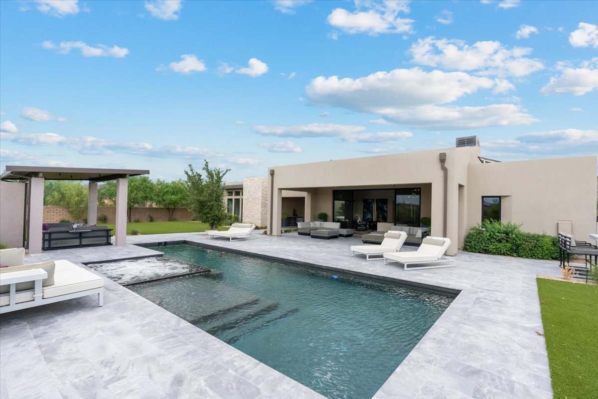 Pool by day with mountain views