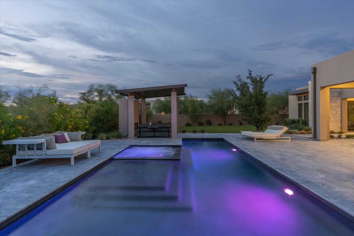 Heated pool and spa lit up at twilight