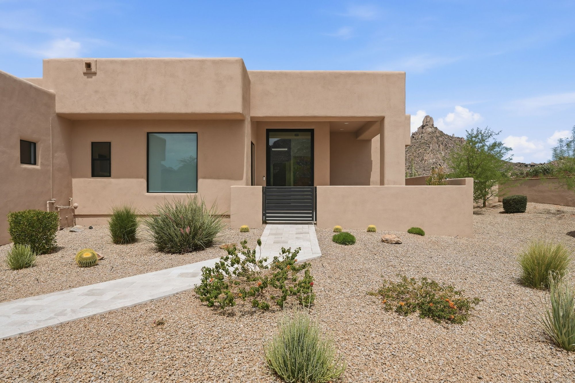 Front entry of 25838 N 104th Pl with desert landscaping