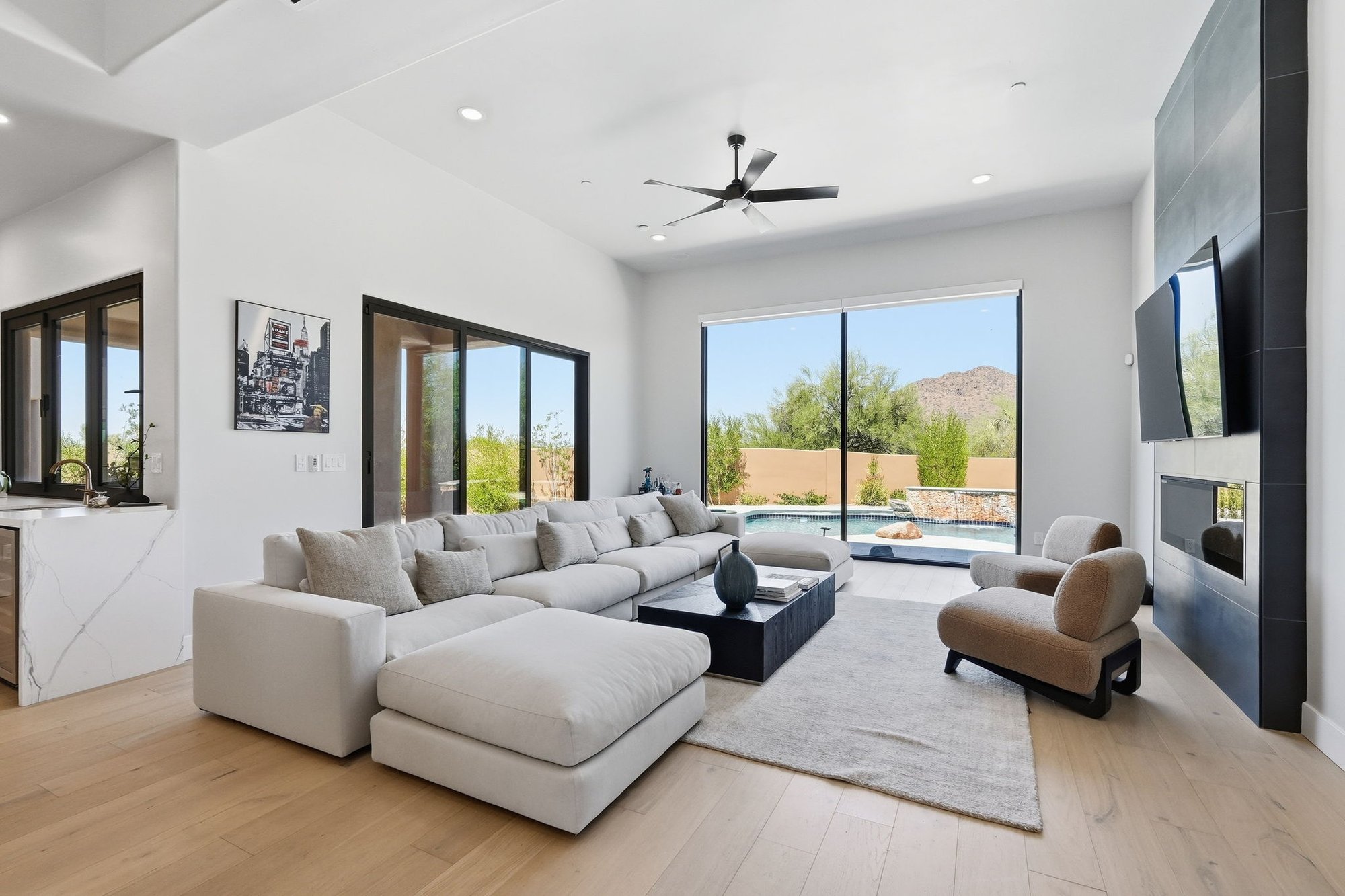 Living room with tall windows and mountain views