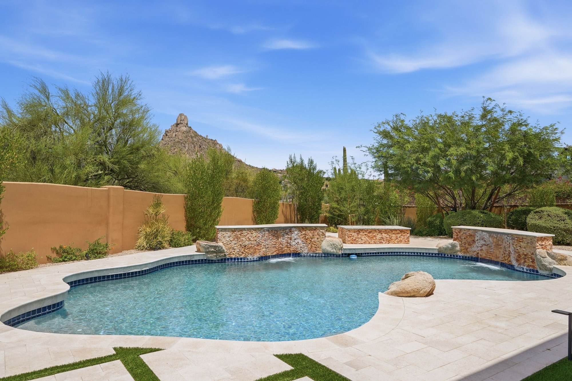 Private pool with a rock waterfall feature