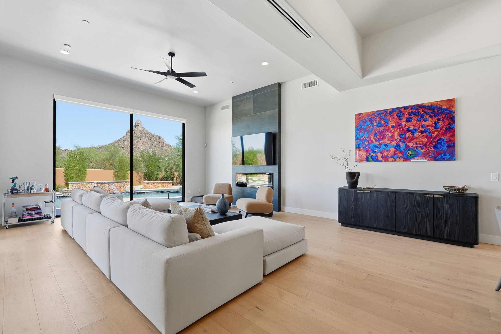Primary bedroom with large windows and desert views