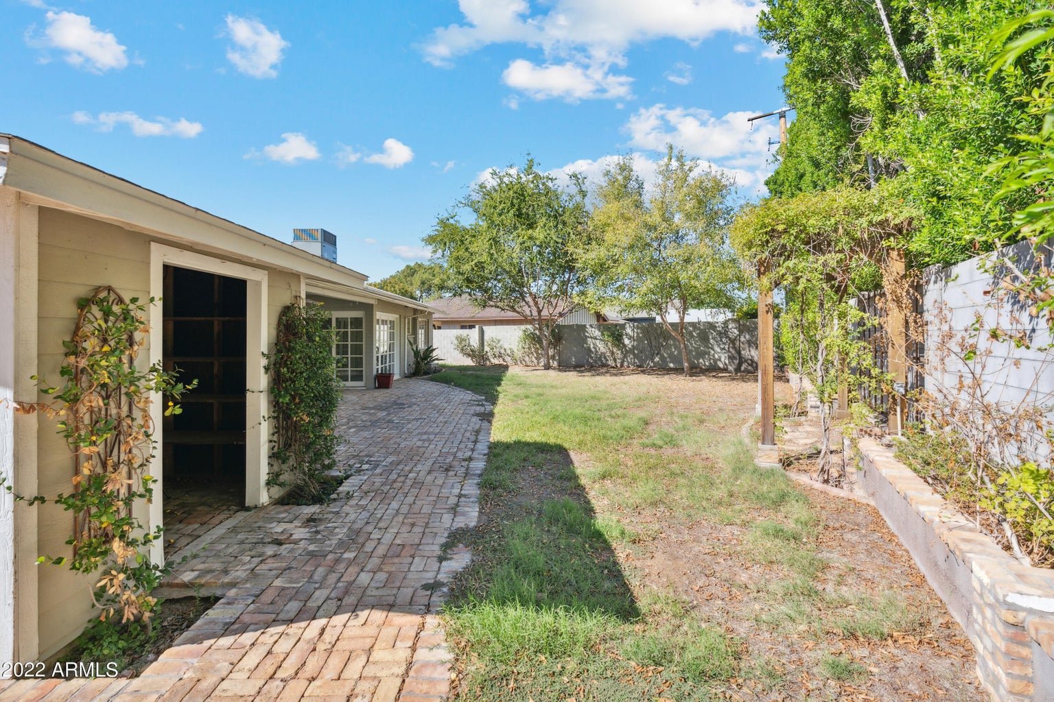 Large grassy backyard on the corner lot