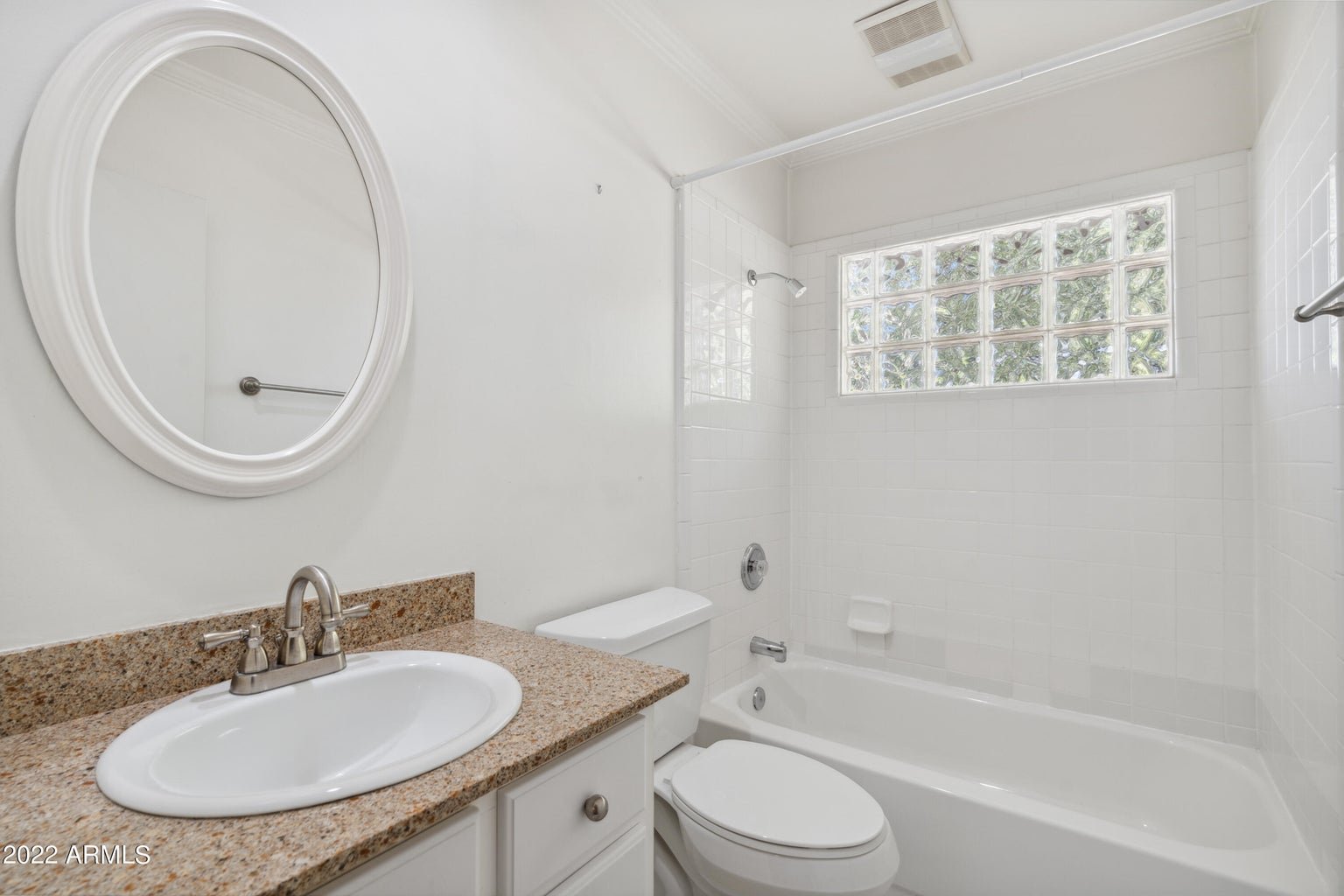 Bathroom with a tub and vanity