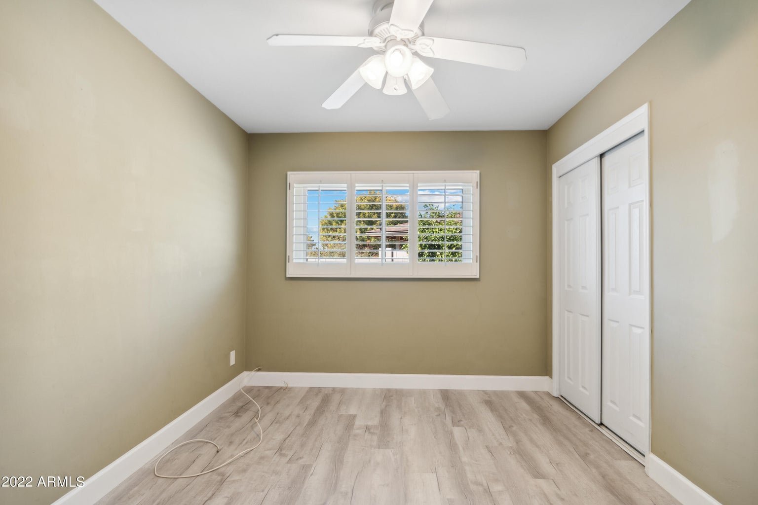 Second bedroom with plantation shutters