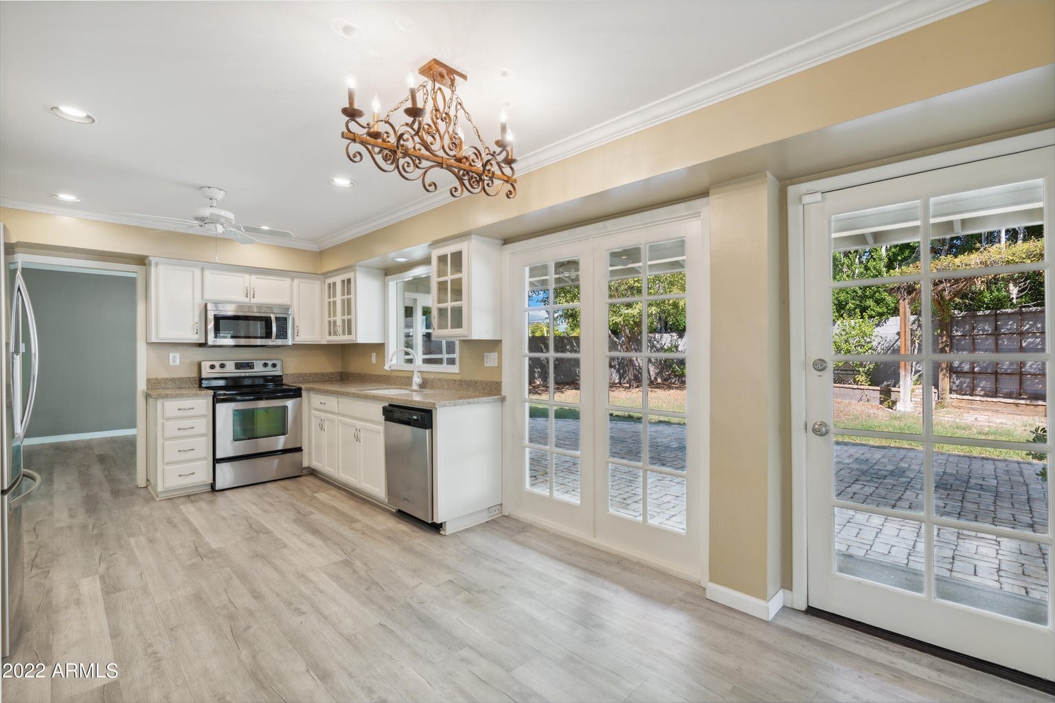 Formal dining area with a chandelier and French doors