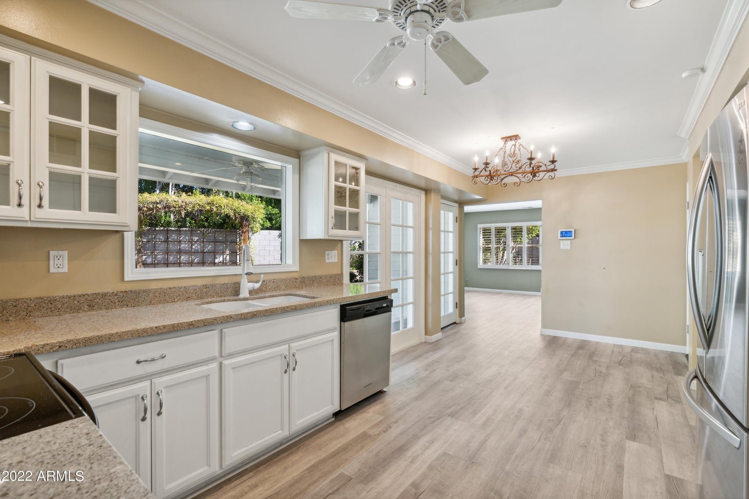 Kitchen with white cabinetry and stainless steel appliances