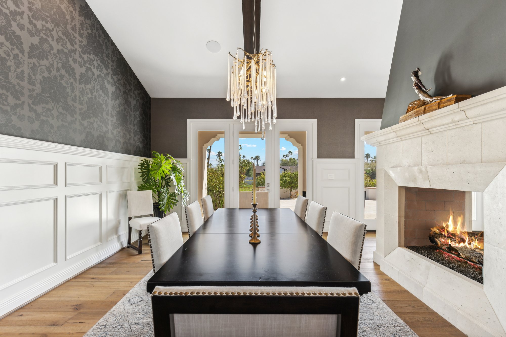Dining room with chandelier and fireplace