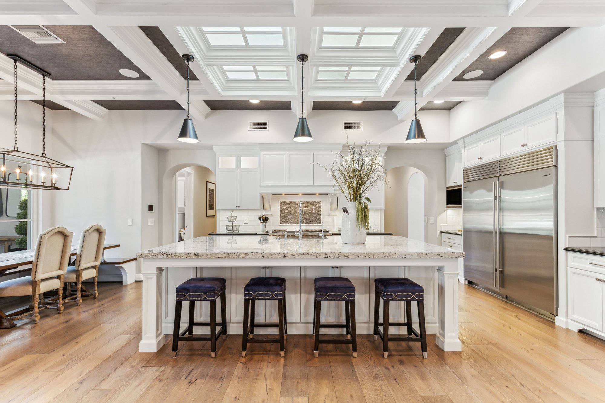 Kitchen with coffered ceiling and skylights