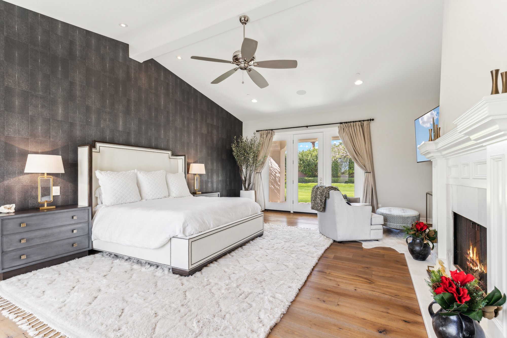 Primary bedroom with fireplace and outdoor access