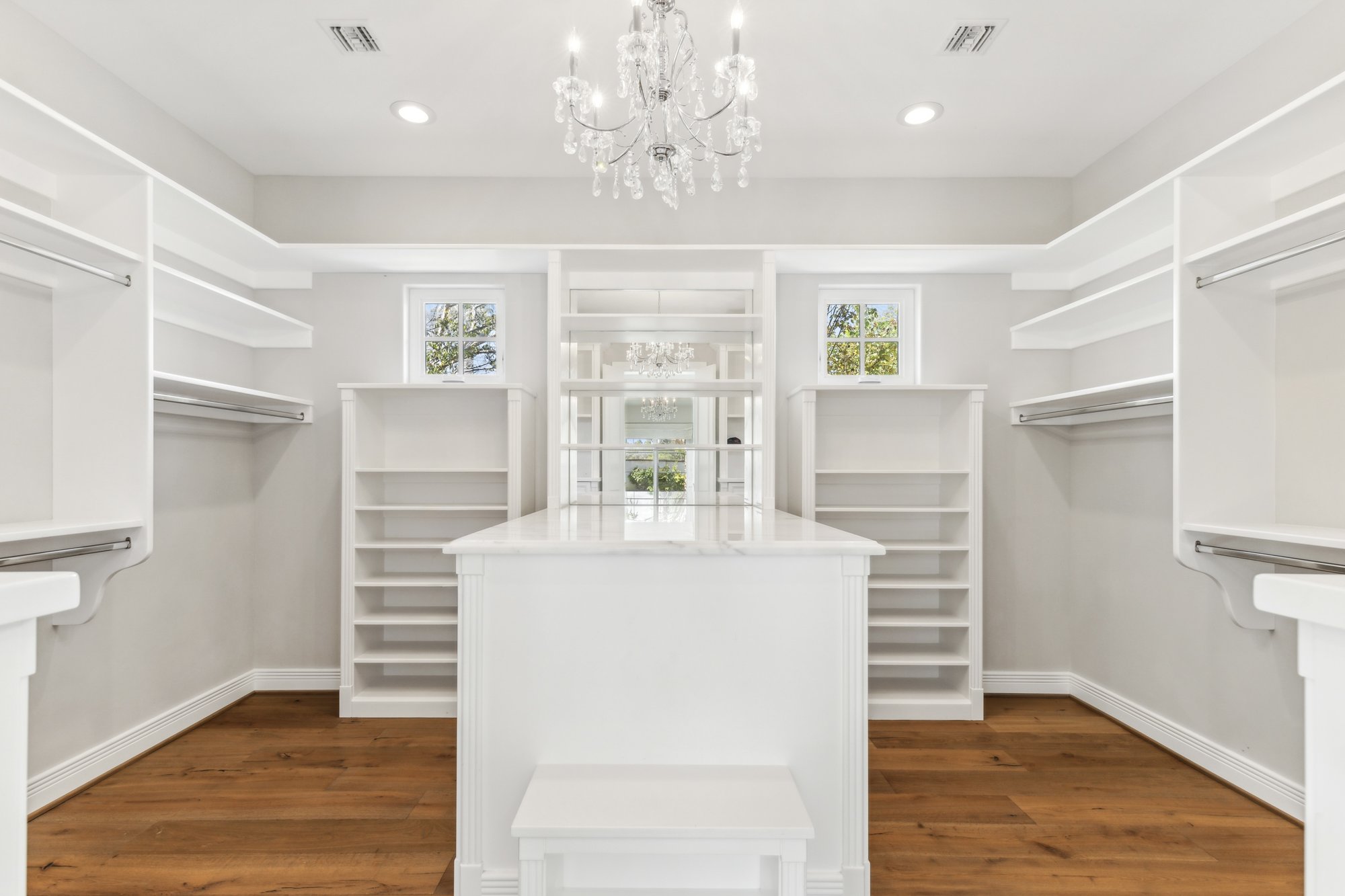 Primary walk-in closet with center island