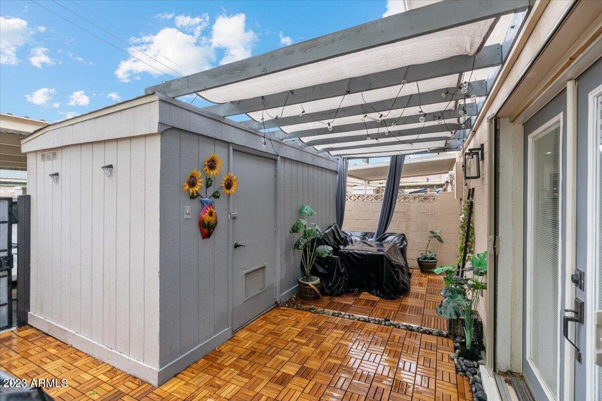 Back patio with a pergola awning