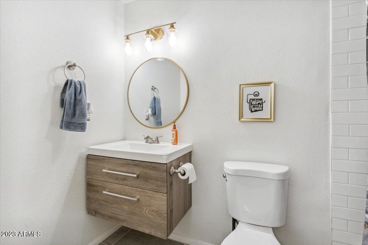 Powder bathroom with a floating vanity