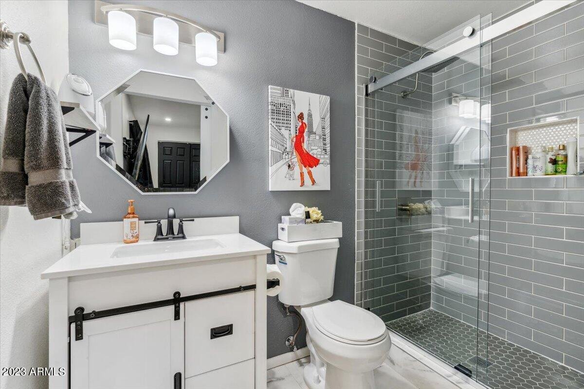 Primary bathroom with a barn door glass shower