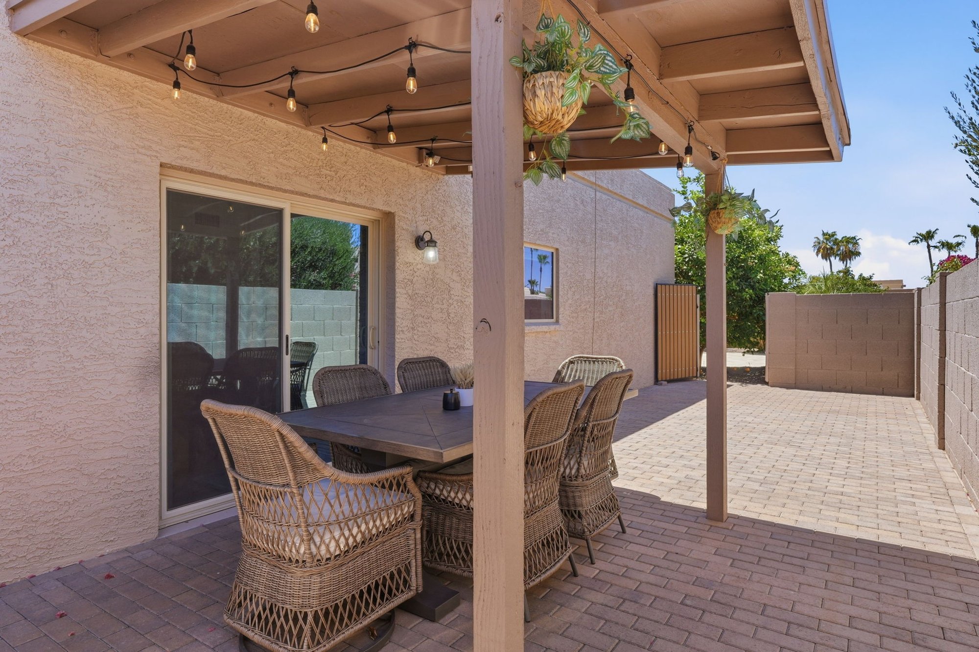 Covered patio with outdoor dining and lounge seating