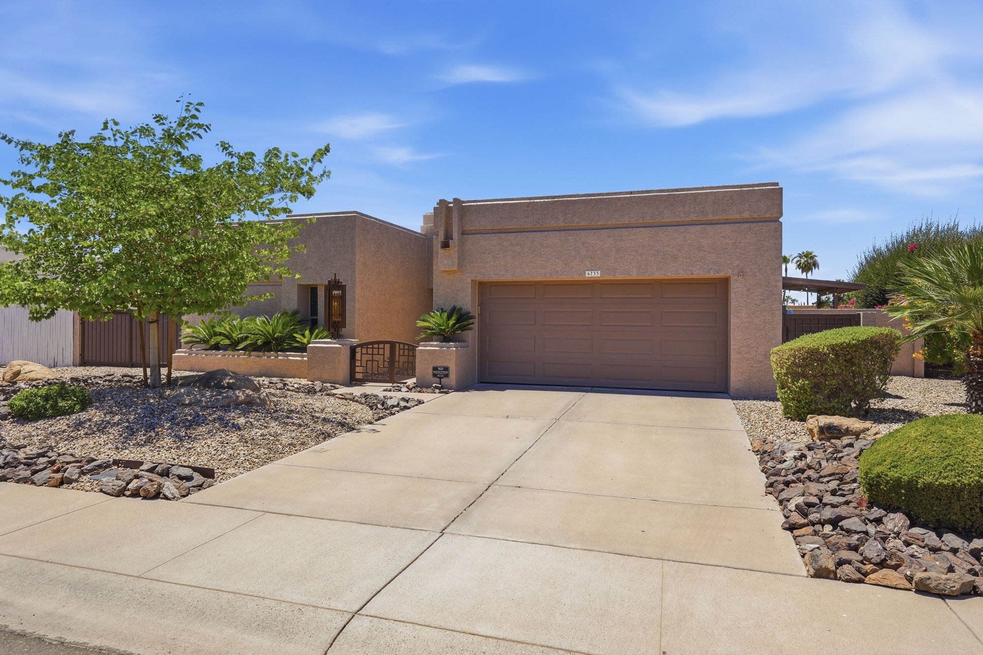 Front exterior of 6733 E Phelps Rd in Scottsdale with desert landscaping