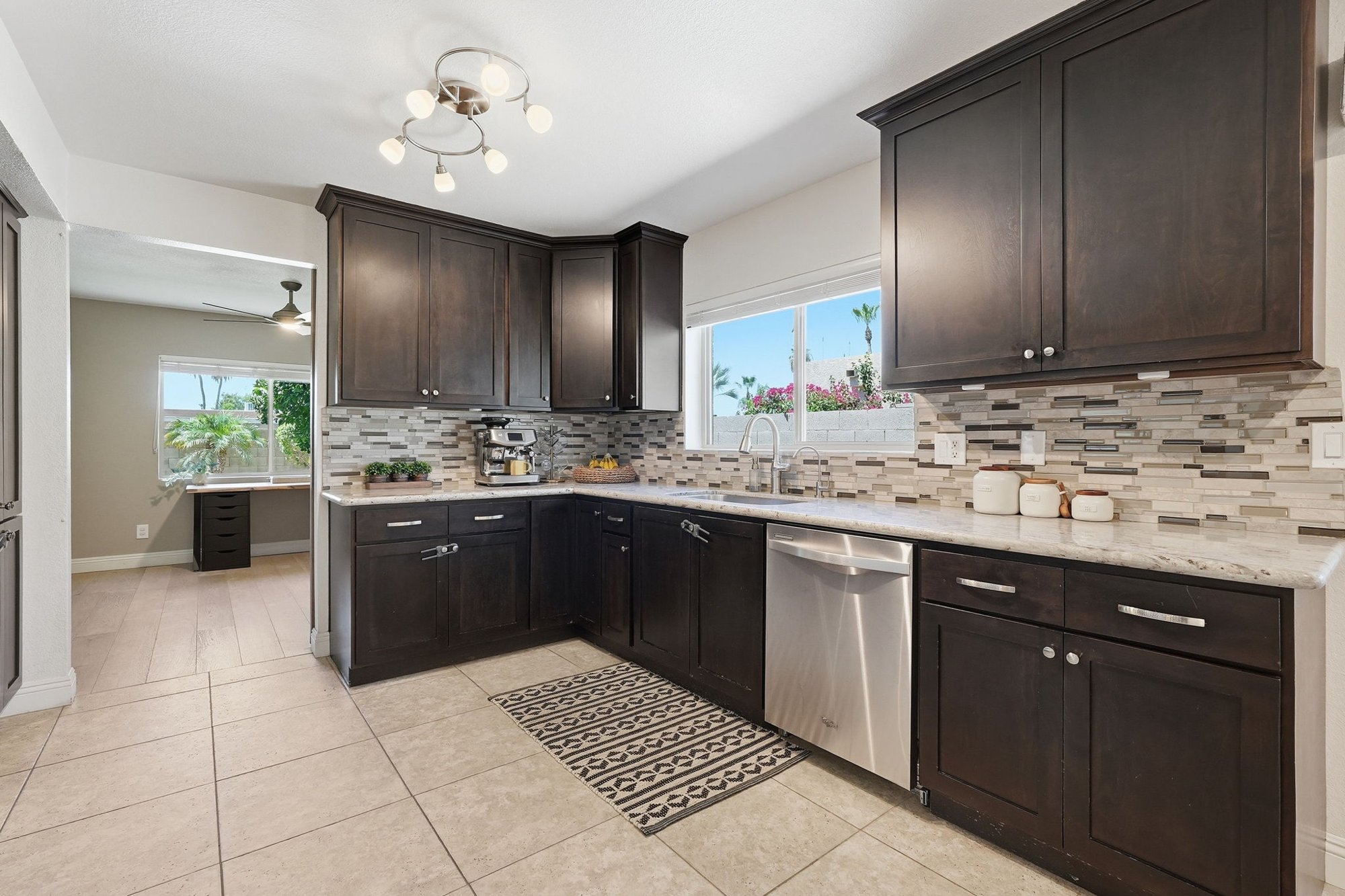 Updated kitchen with granite counters and tile flooring