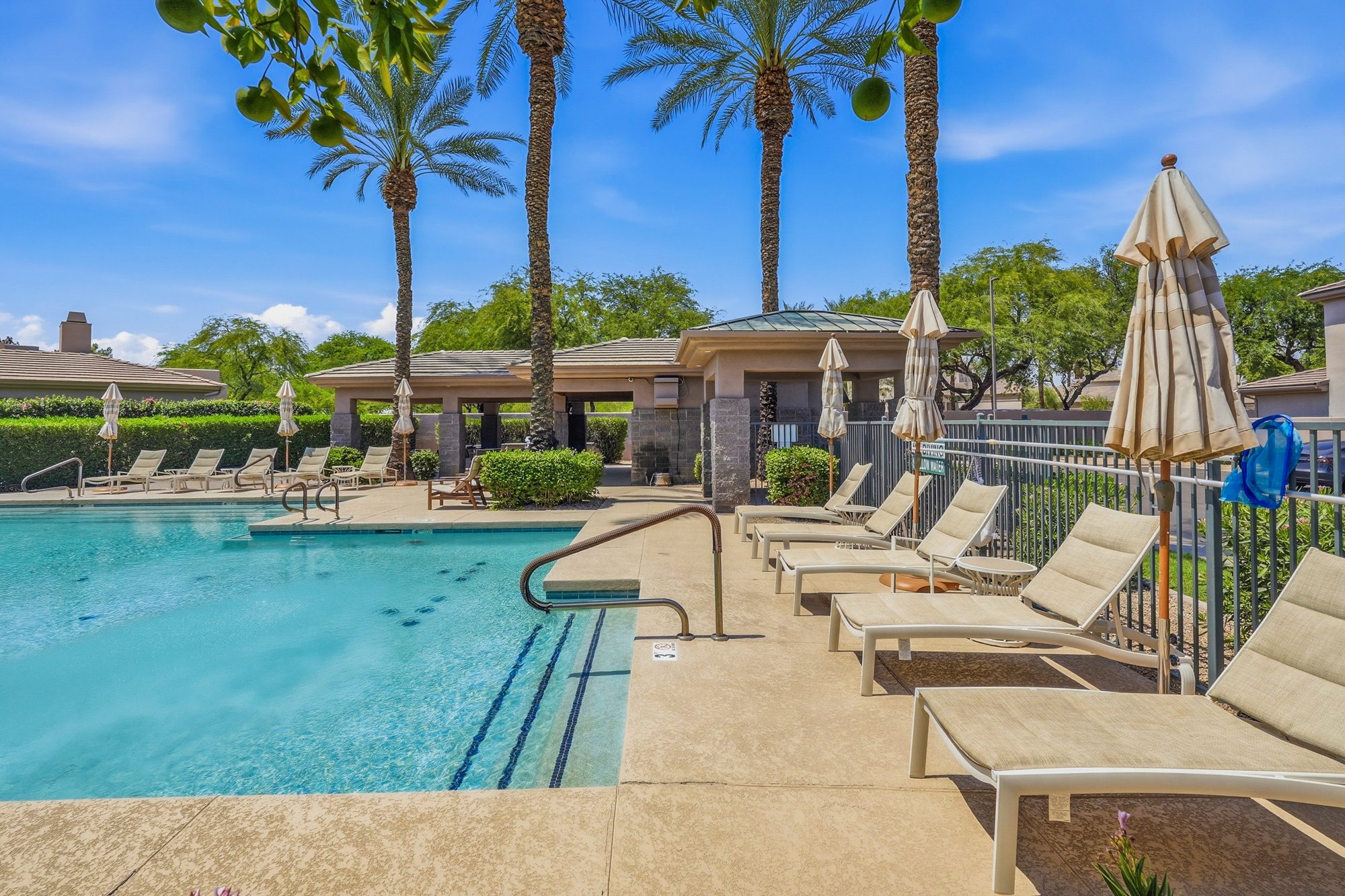 Gainey Village community pool and lounge seating during the day