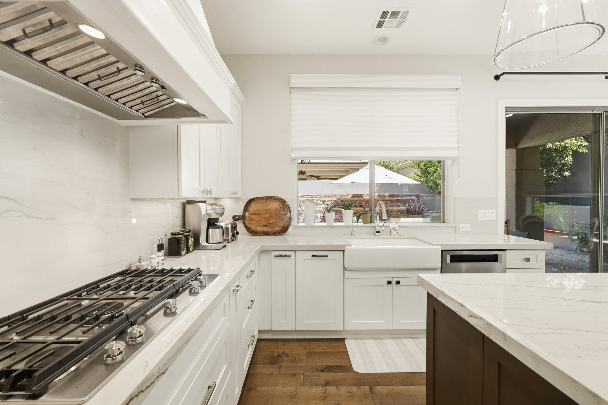 Kitchen gas cooktop and range hood detail