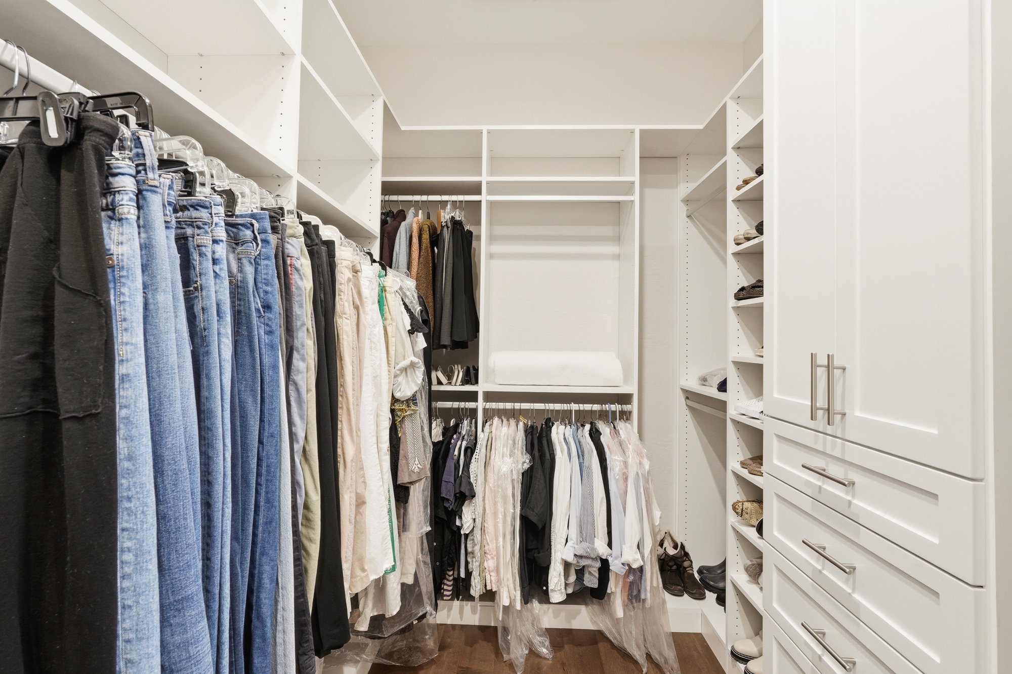 Primary walk-in closet with custom built-ins
