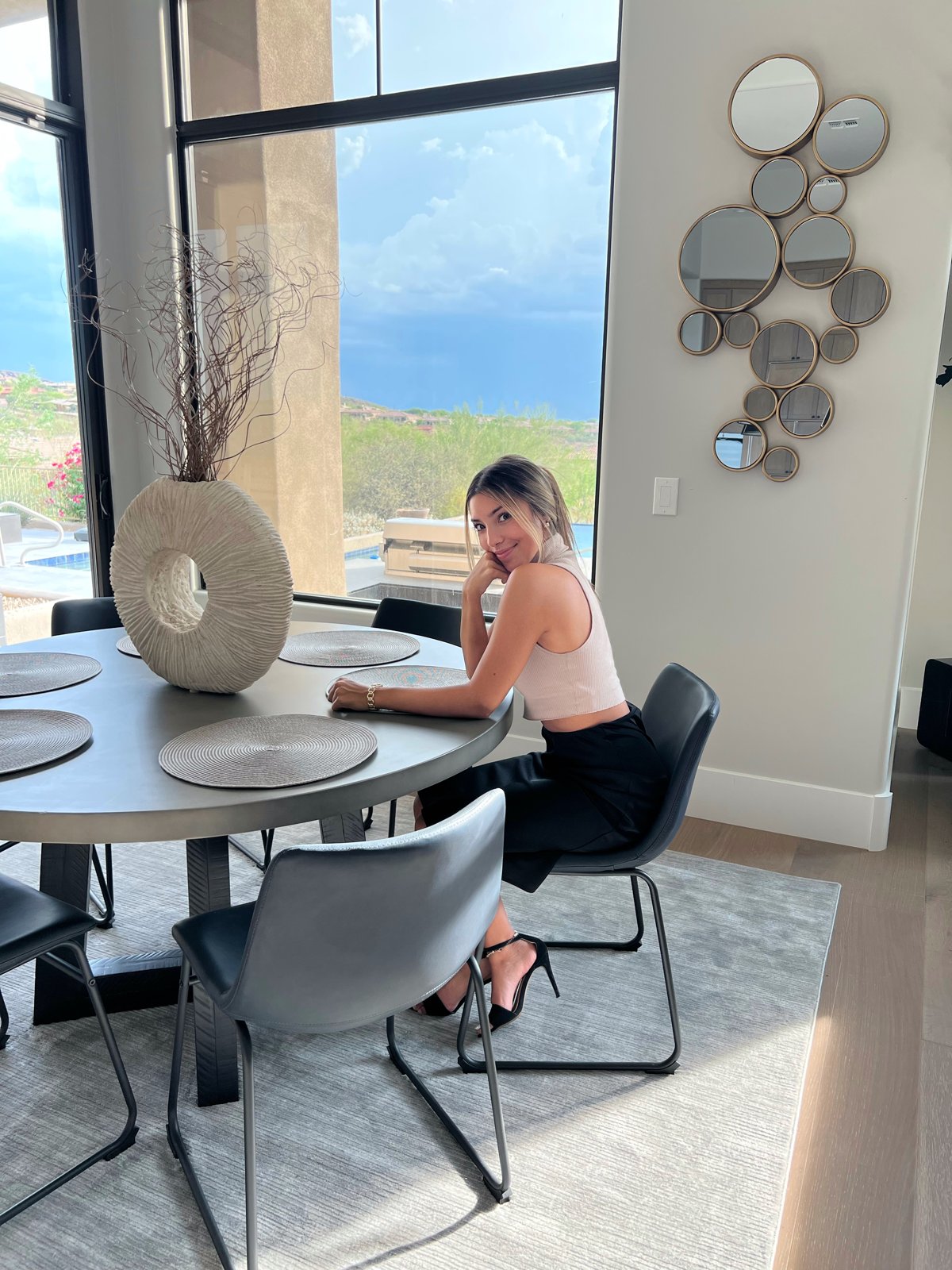 Kyara Eyre seated at a dining table at home