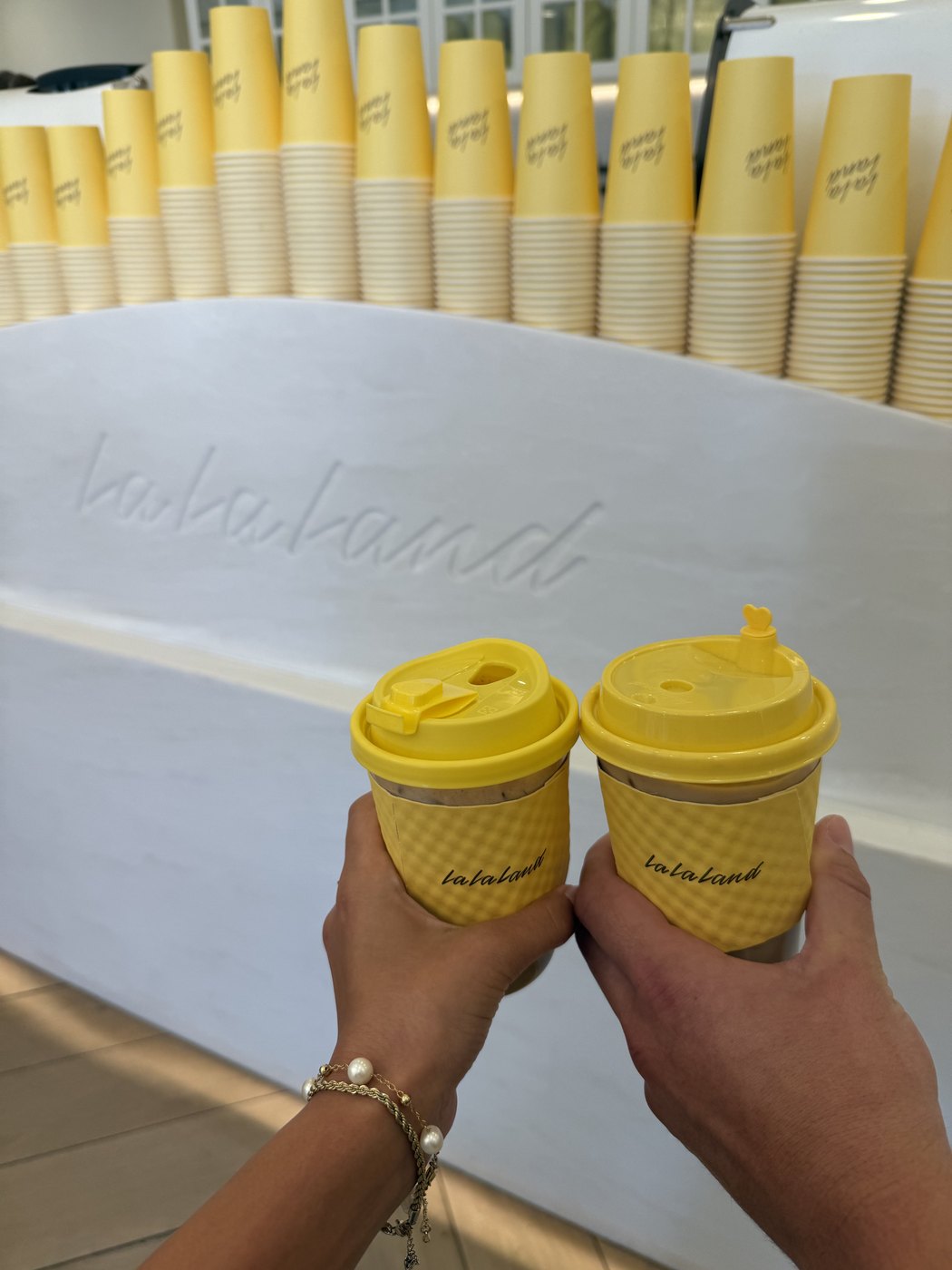 Two coffee cups from Lalaland coffee shop