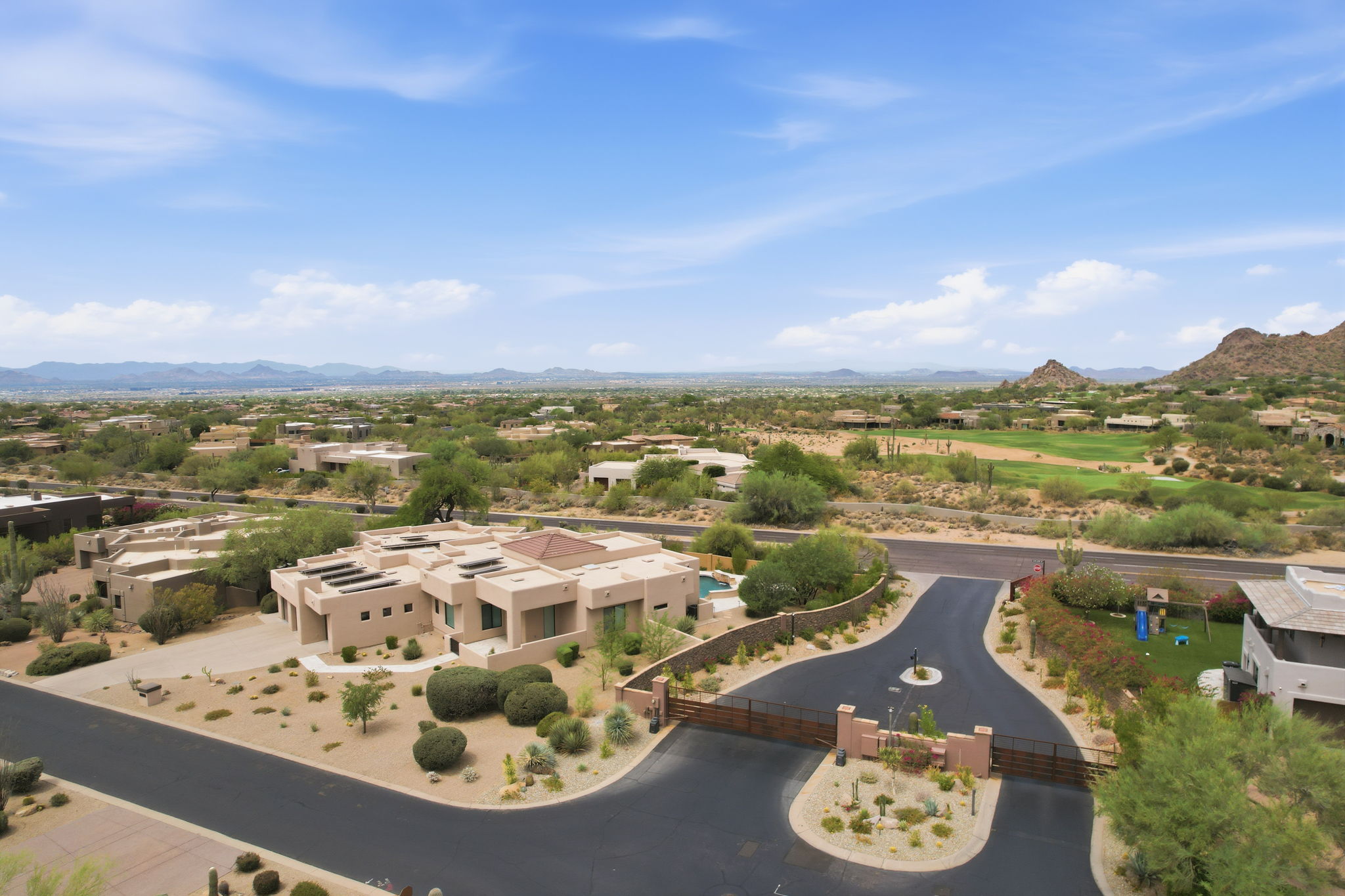 Aerial view of a guard-gated North Scottsdale estate with mountain views